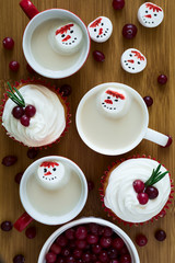 Several cups of hot chocolate with marshmallows in snowmen shape