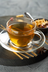 Cup of hot apple tea with spices
