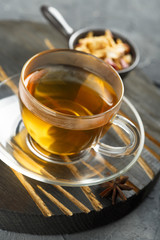 Cup of hot apple tea with spices