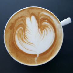 Close up Coffee latte art on black background.