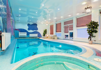 Obraz na płótnie Canvas Swimming pool interior design with blue mosaic