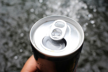 Selfie of hand with cola can