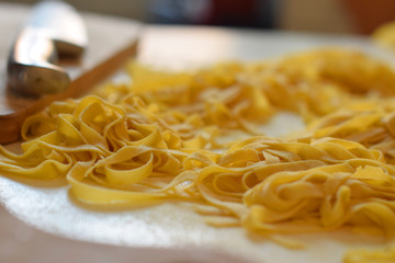 Fresh handmade tagliatelle  on the table