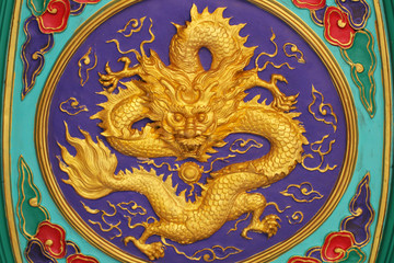 close-up golden dragon marble carving wall, Decorative Chinese art style at Chinese public temple