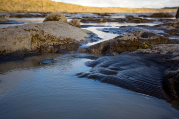 Mud puddle. Sellfoss and Dettifoss waterfalls area, Iceland.