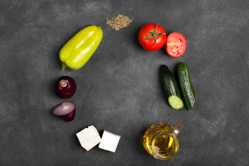 Greek salad with fresh vegetables, feta cheese and black olives. Top view