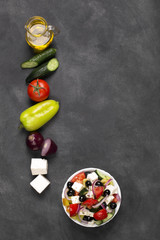 Greek salad with fresh vegetables, feta cheese and black olives. Top view