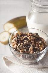 Granola in the glass bowl vertical
