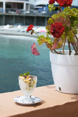 Ice cream with fruit and grated chocolate in a glass
