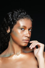 Obraz premium Beauty portrait of beautiful african young woman with fashion makeup