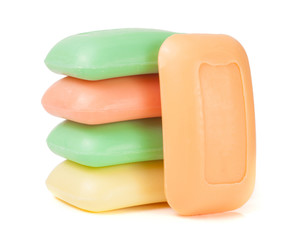 stack of soap different colors isolated on white background