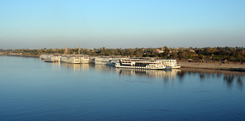 Naklejka na ściany i meble Evening view of the Nile River. Egypt. Africa. Photo partially tinted.