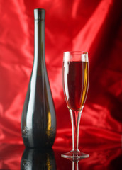 Red wine glass and bottle