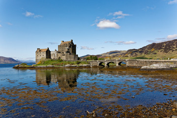 Naklejka na ściany i meble Eilean Donan Castle located in Scotland, UK, beautiful weather