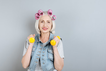 Smiling senior woman doing exercises.