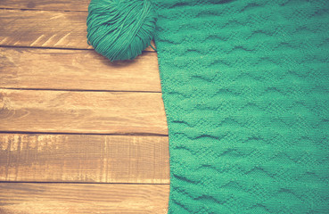 knitting on wooden surface. Vintage style