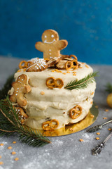 A cake decorated in the Christmas theme with gingerbread