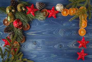 green branch and red xmas decorations on boards