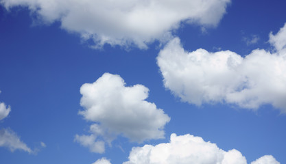 Obraz na płótnie Canvas the white clouds floating on a background of blue sky