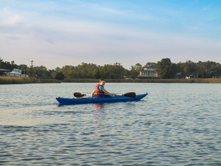 Fototapeta na wymiar Teen girl sea kayaking