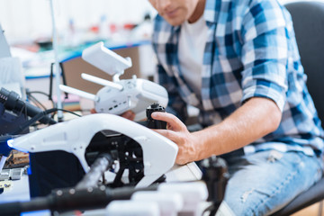 Close up of a man working hard with drone