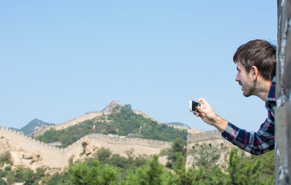 Happy tourist on the Great Wall of China