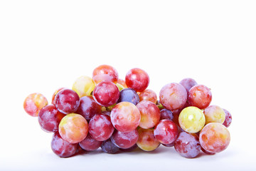Fresh red grapes with white background