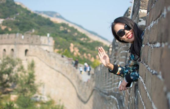 Happy tourist on the Great Wall of China