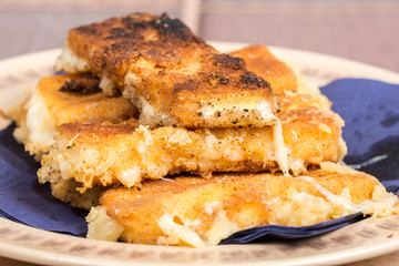 Delicious melting fried yellow cheese in eggs
