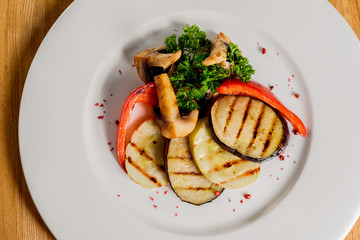 Grilled vegetables on a white plate