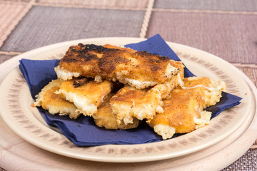Delicious melting fried yellow cheese in eggs