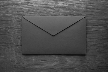 envelope on a black wooden table