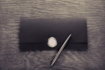 envelope with stamp and pen