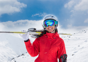 Fototapeta na wymiar Beautiful young woman with ski.