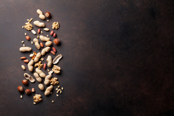 Various nuts on stone table