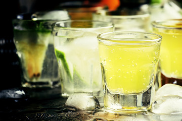 Various cocktails with fruit juice and alcohol, steel background