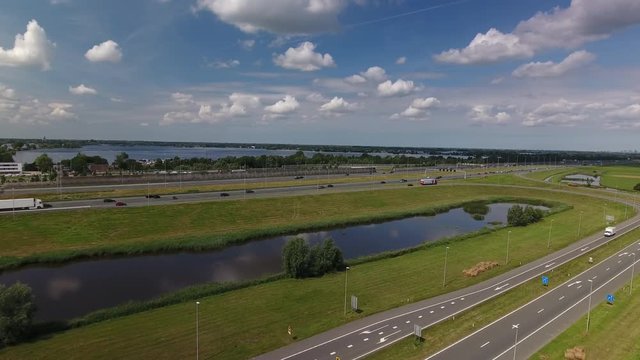 Aerial shot of the A2 highway and exit ramp Vinkeveen in Holland on a beautiful day.