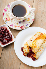 Pancakes with jam and coffee 