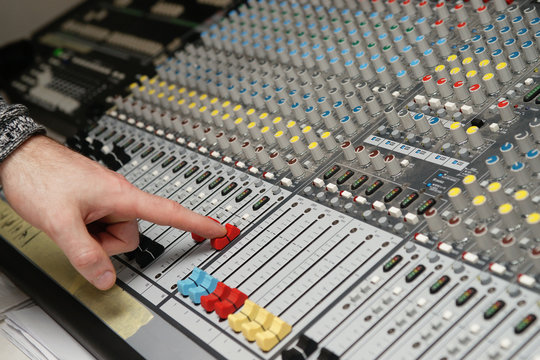 Sound engineer works with sound mixer