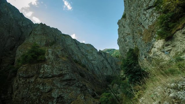 Big mountains and clouds moving. Timelapse slider