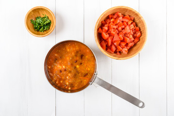 Preparing Chili Bean Stew On White Wood Kitchen Table