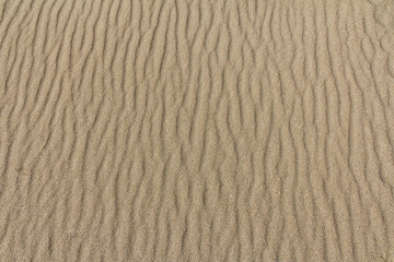 Sand pattern at the beach with selective focus