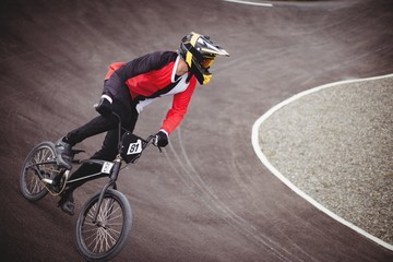 Cyclist riding BMX bike in skate park