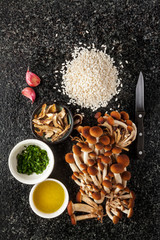 Ingredients for risotto with mushrooms on marble table : mushroo