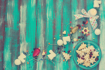 Cookies for Christmas on turquoise dish. Toned Image