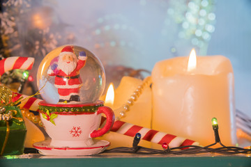 new year still life with Christmas motifs: candles, Santa, toys