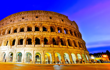 Fototapeta premium View of Colosseum at night in Rome, Italy