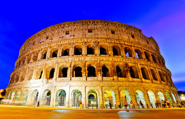 Fototapeta na wymiar View of Colosseum at night in Rome, Italy