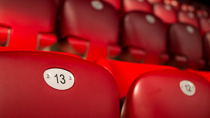 Unlucky Number Thirteen On Empty Red Chair - 128512360