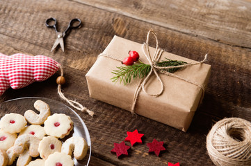 Fototapeta na wymiar Beautifully wrapped Christmas presents, studio shot, wooden back